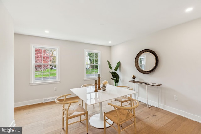 dining room with recessed lighting, visible vents, light wood finished floors, and baseboards