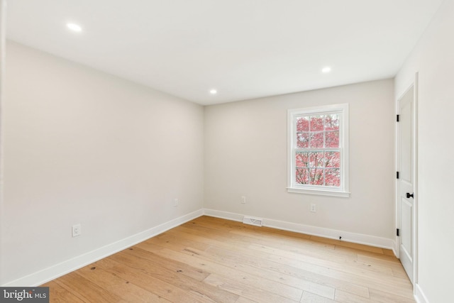 empty room with recessed lighting, visible vents, and light wood-style flooring