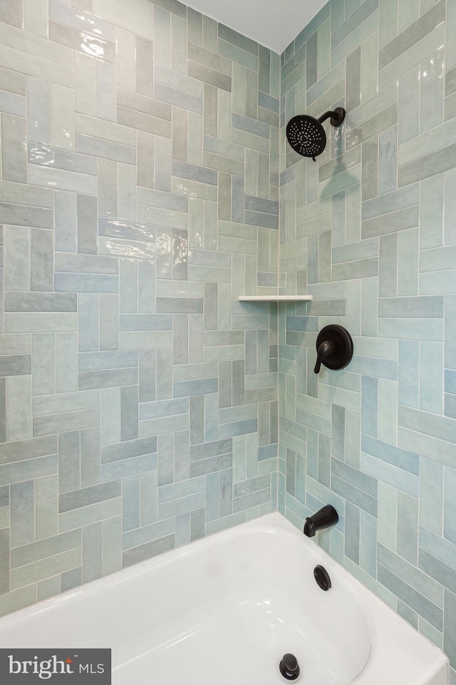 bathroom with a bathtub and a shower