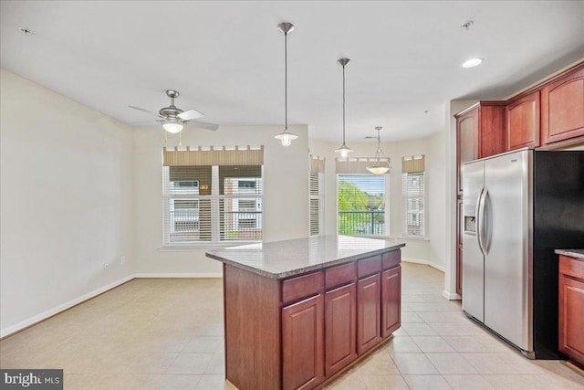 823 Oyster Bay Pl Unit 302, Solomons, MD 20688 - kitchen featuring stainless steel fridge with ice dispenser, ceiling fan, light tile patterned floors, baseboards, and light stone countertops