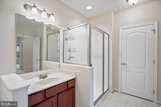 823 Oyster Bay Pl Unit 302, Solomons, MD 20688 - bathroom with a stall shower, tile patterned floors, vanity, and baseboards
