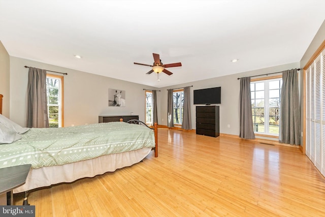 17449 Irishtown Rd, Emmitsburg, MD 21727 - bedroom featuring visible vents, multiple windows, wood finished floors, and a ceiling fan