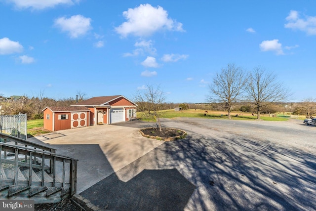 17449 Irishtown Rd, Emmitsburg, MD 21727 - view of front facade with an outbuilding, aphalt driveway, and a garage