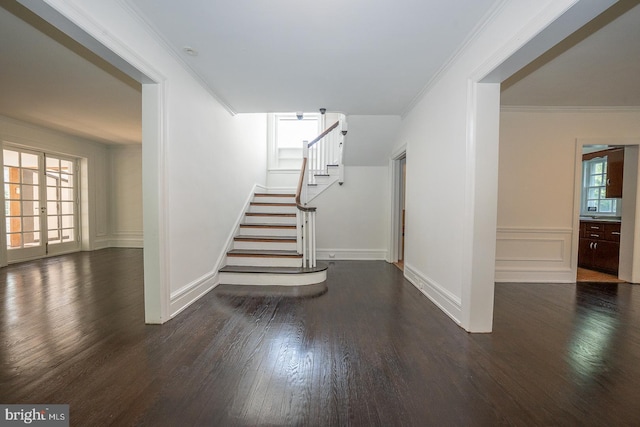 723 S Latches Ln, Merion Station, PA 19066 - staircase featuring wood finished floors, ornamental molding, and wainscoting
