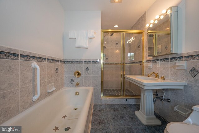 723 S Latches Ln, Merion Station, PA 19066 - bathroom featuring tile walls, a garden tub, tile patterned flooring, a shower stall, and wainscoting