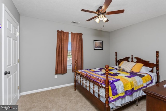bedroom with light carpet, baseboards, a ceiling fan, and visible vents