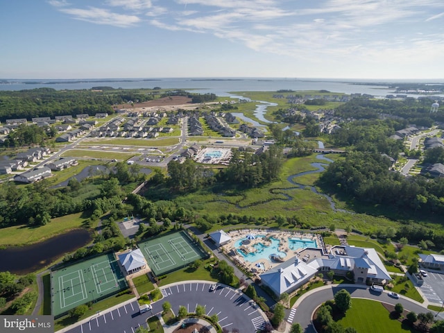 aerial view of property's location with a pool area and a large body of water