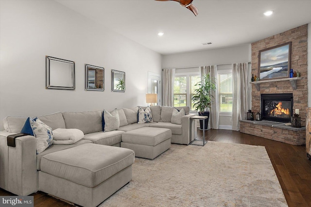 living area with hardwood / wood-style floors, a fireplace, recessed lighting, ceiling fan, and baseboards
