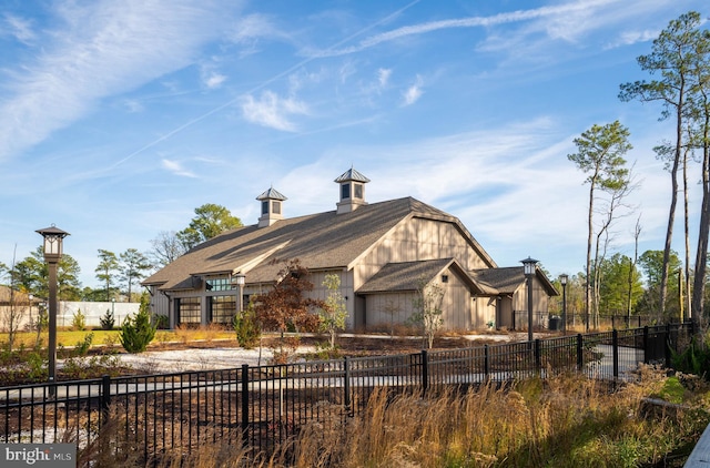 view of building exterior featuring fence