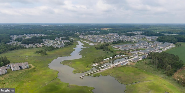 view of property location featuring a nearby body of water and nearby suburban area
