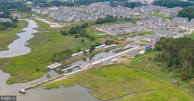 view of property location with a large body of water and nearby suburban area