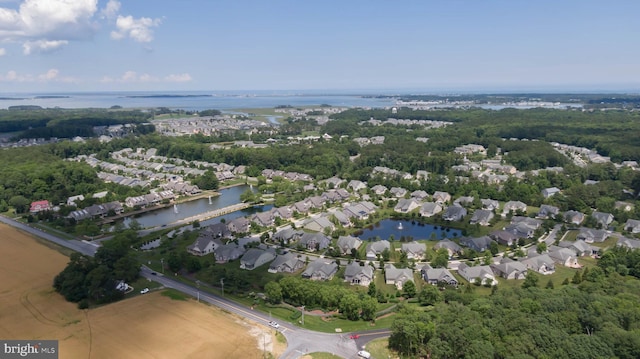 aerial overview of property's location featuring nearby suburban area and a large body of water