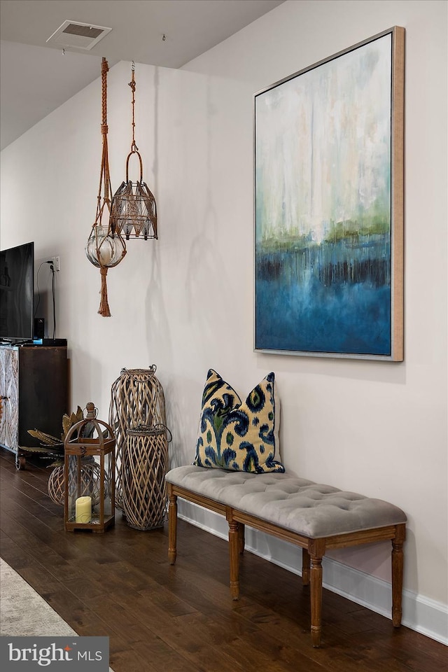 living area with hardwood / wood-style floors and baseboards