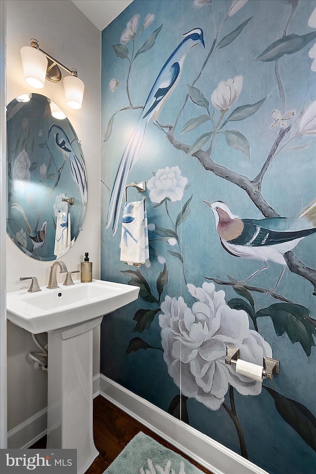bathroom featuring baseboards and wood finished floors