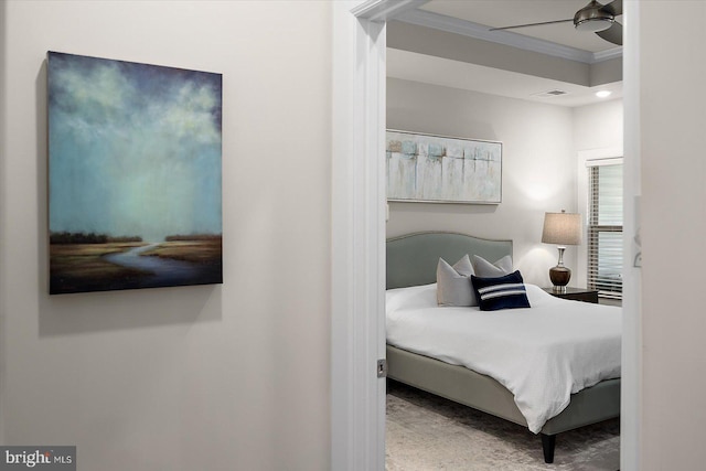 bedroom featuring ornamental molding and ceiling fan