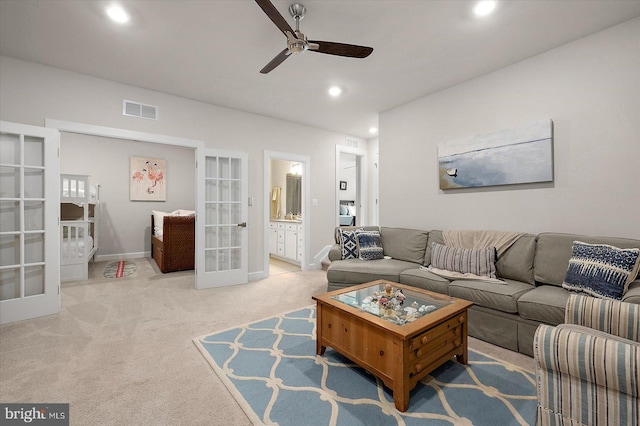 carpeted living area with french doors, a ceiling fan, recessed lighting, and baseboards