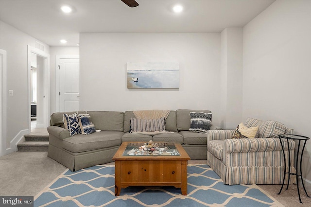 carpeted living area featuring recessed lighting, a ceiling fan, and baseboards
