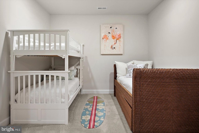 bedroom with carpet flooring and baseboards