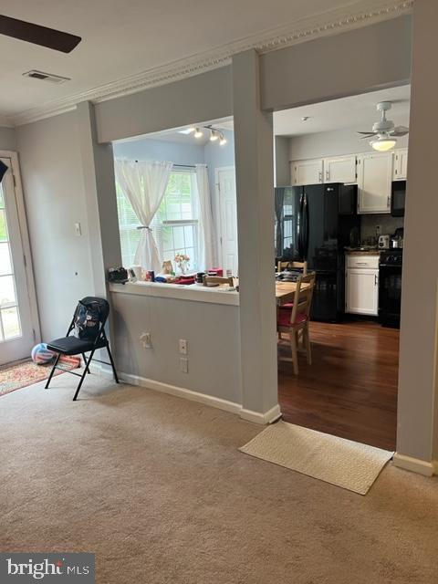 302 Weston Ln Unit 23, New Hope, PA 18938 - sitting room with crown molding, dark carpet, a ceiling fan, and baseboards