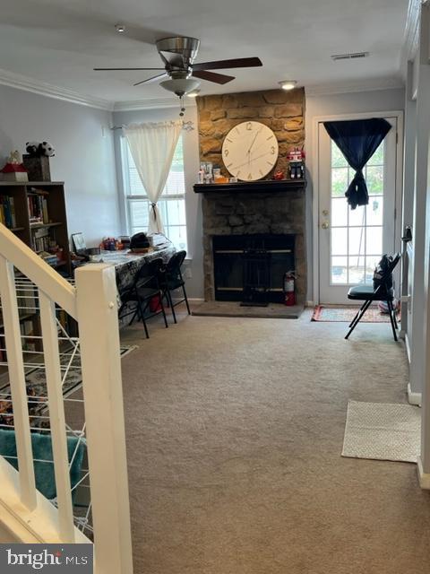302 Weston Ln Unit 23, New Hope, PA 18938 - carpeted living area featuring plenty of natural light, crown molding, a fireplace, and ceiling fan
