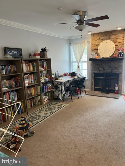 302 Weston Ln Unit 23, New Hope, PA 18938 - dining area featuring a ceiling fan, ornamental molding, carpet, and a fireplace