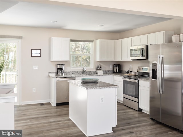 153 Kensington Cir, Middletown, VA 22645 - kitchen with white cabinets, a healthy amount of sunlight, stainless steel appliances, and a sink