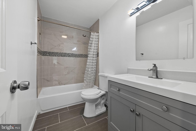 full bathroom with shower / tub combo with curtain, toilet, and vanity