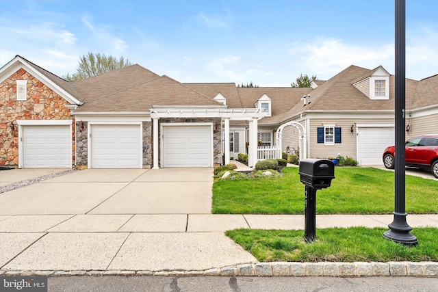 29 Sparrow Dr, Hamilton, NJ 08690 - view of property with driveway, a garage, stone siding, and a front lawn