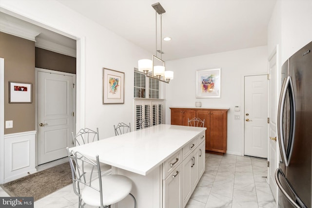 29 Sparrow Dr, Hamilton, NJ 08690 - kitchen featuring white cabinets, freestanding refrigerator, marble finish floor, and a breakfast bar area