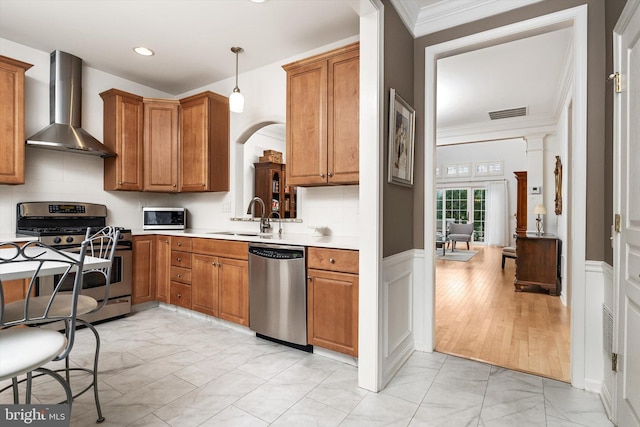 29 Sparrow Dr, Hamilton, NJ 08690 - kitchen with brown cabinets, wall chimney exhaust hood, appliances with stainless steel finishes, marble finish floor, and a sink