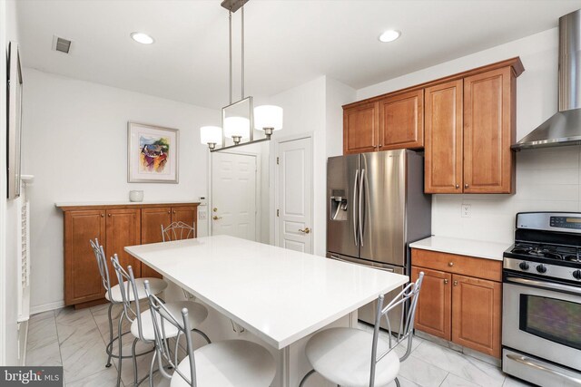29 Sparrow Dr, Hamilton, NJ 08690 - kitchen with wall chimney range hood, appliances with stainless steel finishes, a breakfast bar, brown cabinetry, and marble finish floor