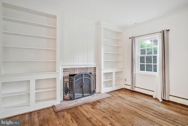 8205 Robin Hood Ct, Towson, MD 21204 - unfurnished living room featuring wood finished floors, built in shelves, a brick fireplace, and crown molding