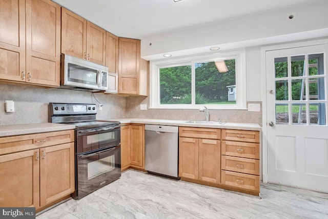 8205 Robin Hood Ct, Towson, MD 21204 - kitchen with stainless steel appliances, a sink, healthy amount of natural light, light countertops, and recessed lighting
