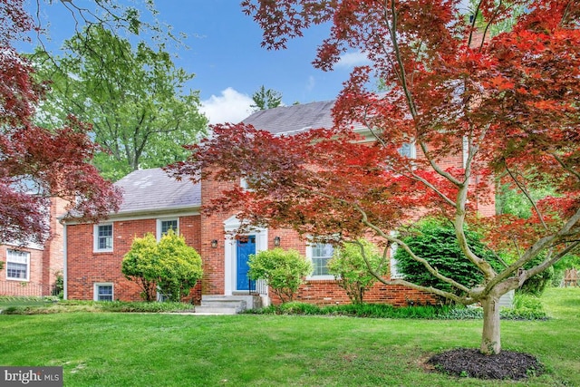 8205 Robin Hood Ct, Towson, MD 21204 - view of front of home with brick siding and a front lawn