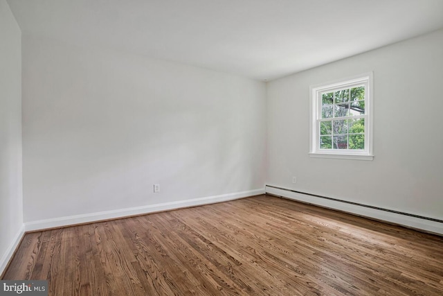 8205 Robin Hood Ct, Towson, MD 21204 - unfurnished room featuring wood finished floors, baseboards, and baseboard heating