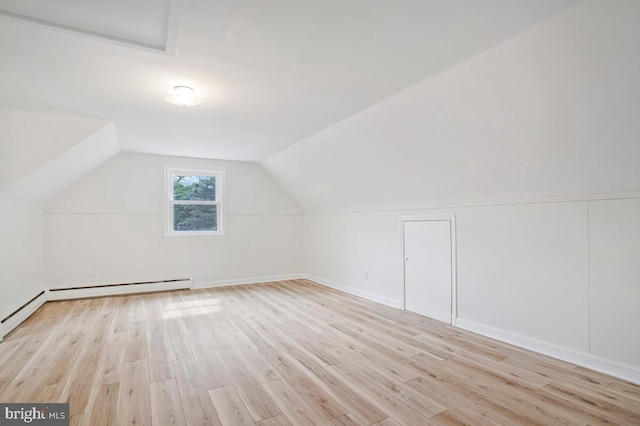 8205 Robin Hood Ct, Towson, MD 21204 - bonus room featuring light wood-style flooring, vaulted ceiling, and baseboards