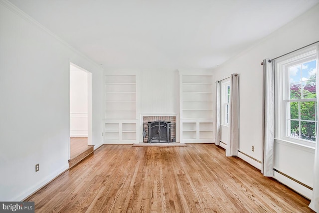 8205 Robin Hood Ct, Towson, MD 21204 - unfurnished living room with built in shelves, baseboards, light wood-style flooring, ornamental molding, and a baseboard heating unit