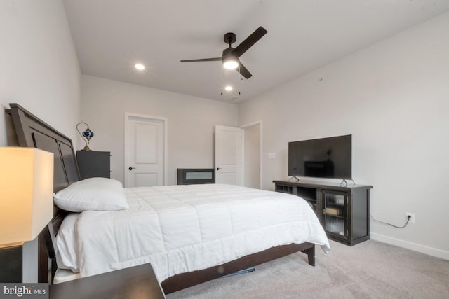 bedroom with ceiling fan, light colored carpet, baseboards, and recessed lighting