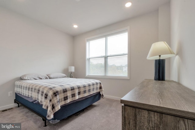 bedroom with light carpet, baseboards, visible vents, and recessed lighting