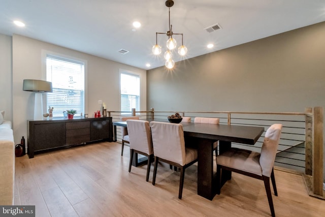 dining space featuring visible vents, light wood-style flooring, and recessed lighting