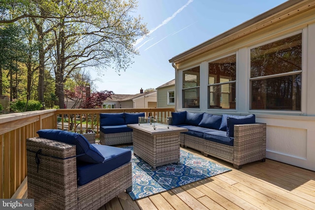 wooden terrace featuring outdoor lounge area