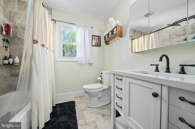 full bath with visible vents, shower / tub combo, baseboards, vanity, and toilet