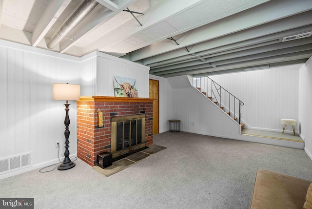 living room with carpet floors, baseboards, visible vents, and stairs