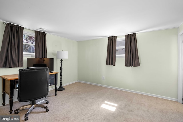carpeted office featuring baseboards