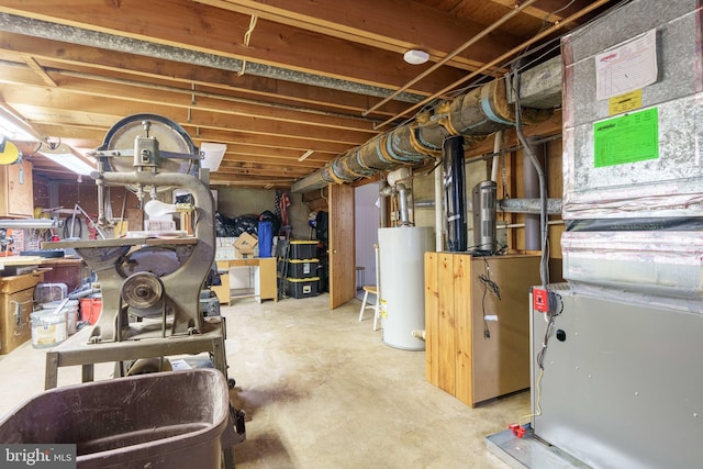 unfinished below grade area featuring heating unit and water heater