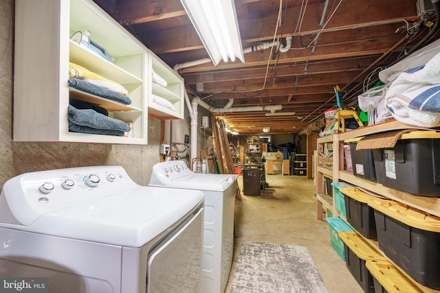 clothes washing area featuring laundry area and washer and dryer