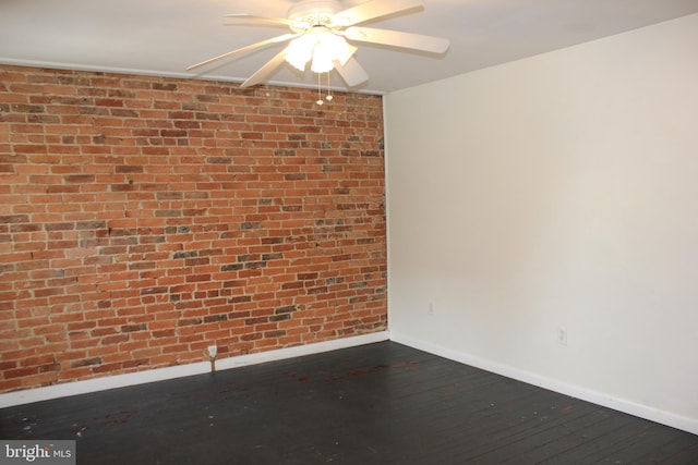 empty room with baseboards, hardwood / wood-style flooring, and ceiling fan