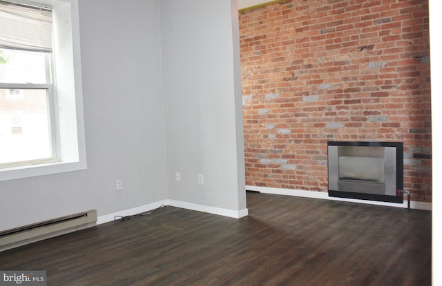 unfurnished living room with baseboard heating, baseboards, and dark wood-style flooring