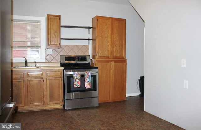 kitchen with stainless steel electric range oven, a sink, decorative backsplash, and brown cabinetry