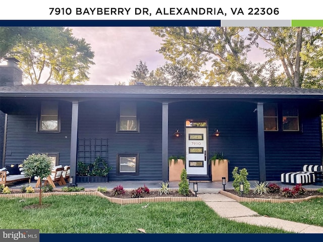 7910 Bayberry Dr, Alexandria, VA 22306 - view of front facade with covered porch and a front lawn
